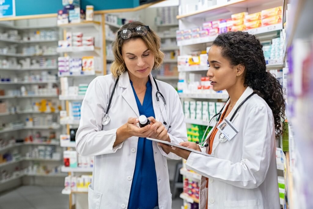 two-pharmacists-working-together-at-pharmacy-1536x1024